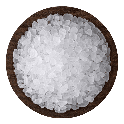 Large transparent white salt chunks displayed neatly inside a wooden serving bowl.