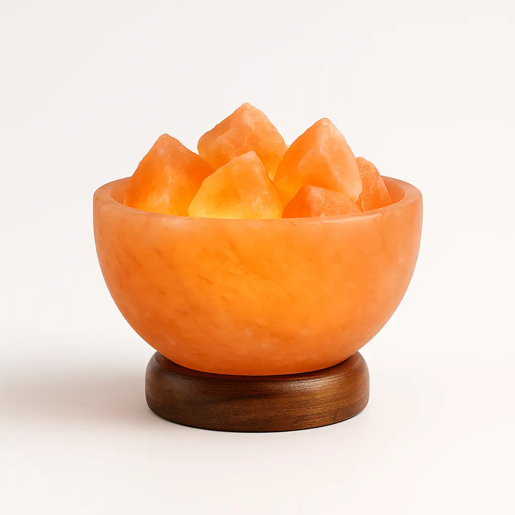 Himalayan fire bowl salt lamp with glowing pink salt chunks in a polished bowl on a wooden base, white background.
